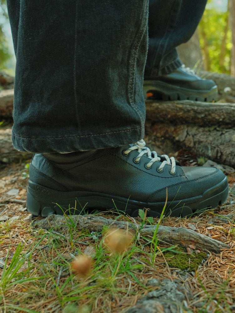 Paper Straight Alpine Hiker Black — worn with wide-leg trousers, Swiss Alps