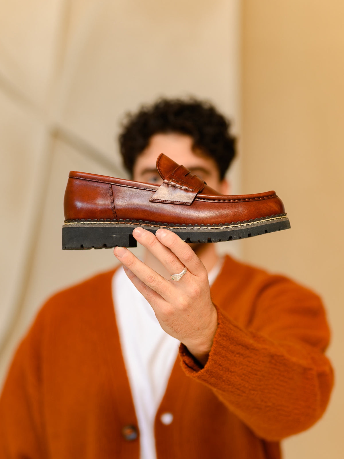 Paper Straight Atlas Loafer Rust — side profile held up to the camera