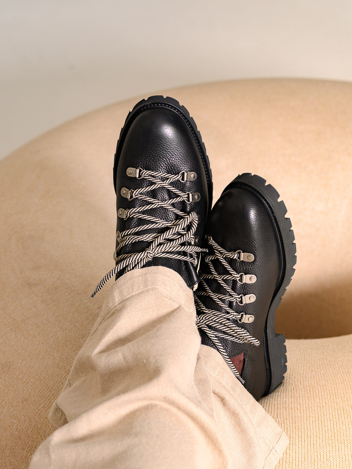 Paper Straight Heritage Derby Black Grain — worn, crossed feet showing the lug sole