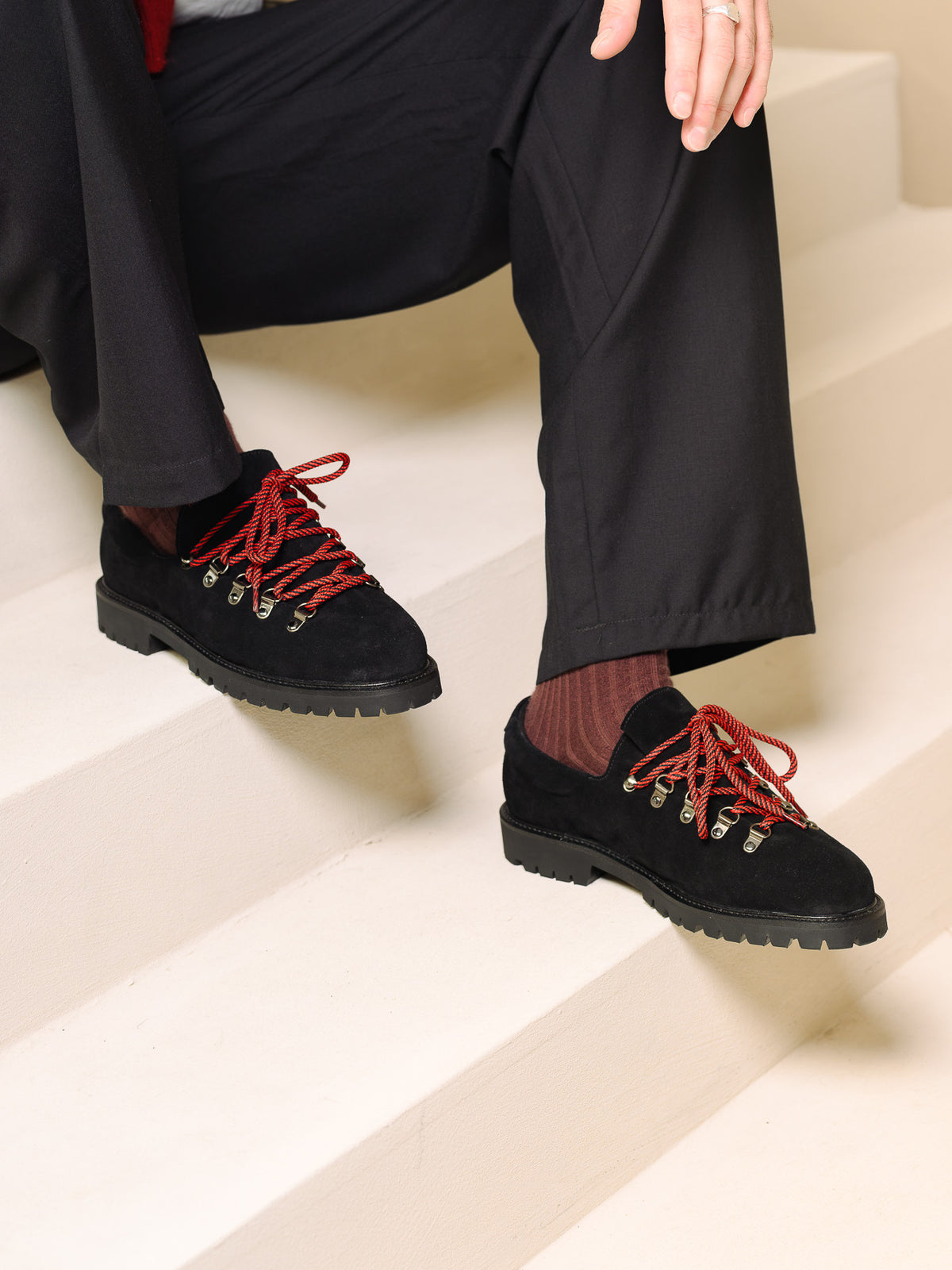 Paper Straight Heritage Derby Black Suede — worn with black trousers on cream steps