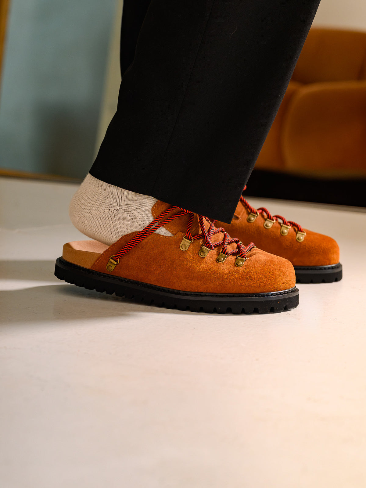 Paper Straight Summit Mule Rust — worn with black trousers, side profile