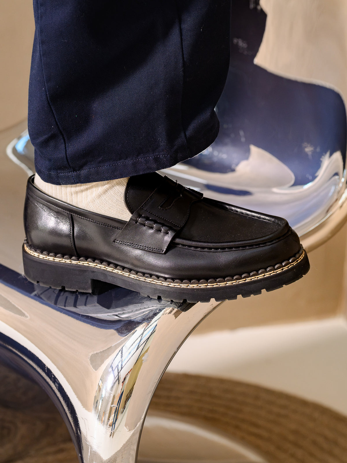 Paper Straight Atlas Loafer Black — worn with navy trousers, side profile