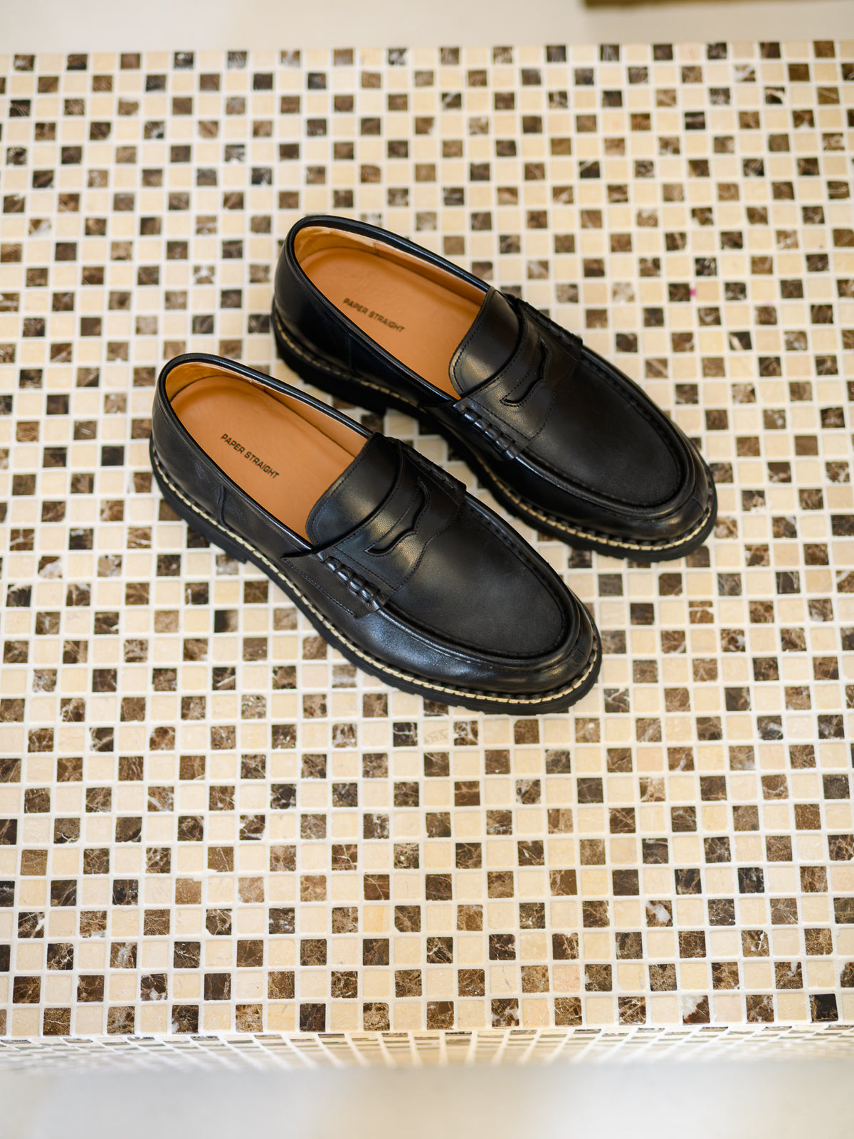 Paper Straight Atlas Loafer Black — pair on a mosaic table, seen from above