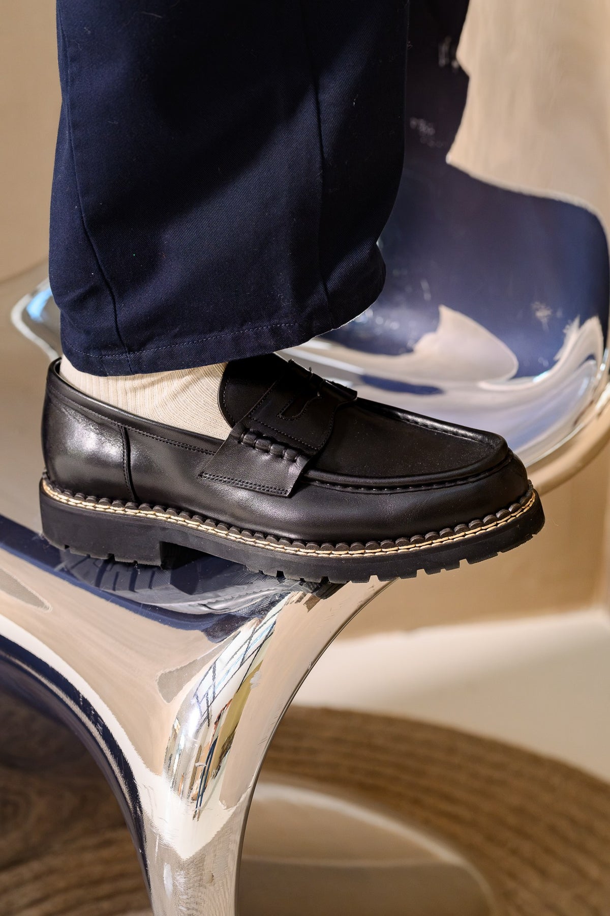 Paper Straight Atlas Loafer in black leather worn with navy trousers