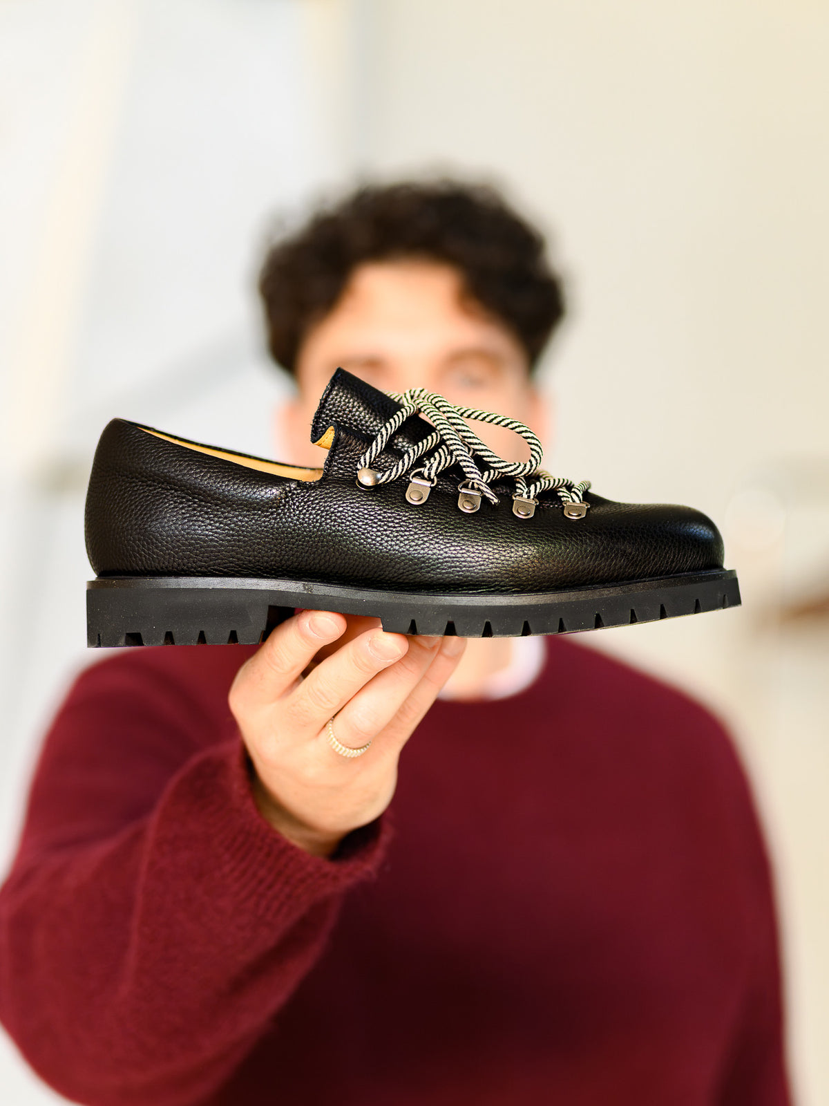 Paper Straight Heritage Derby Black Grain — side profile held up to the camera