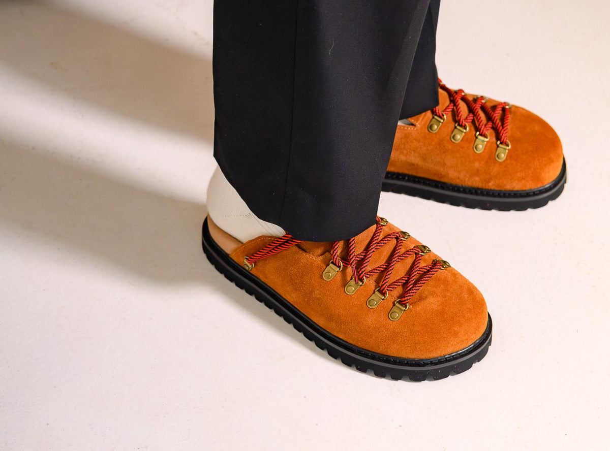 Paper Straight Summit Mule in rust suede worn with black trousers