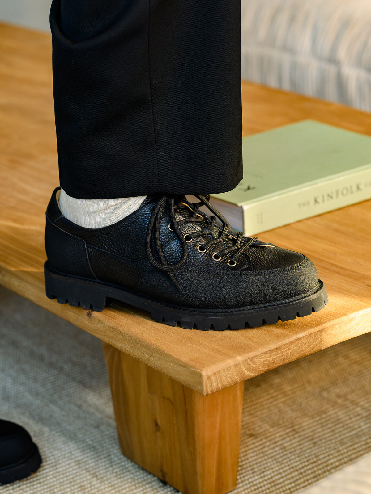 Paper Straight Ridgeworks Low Black — worn with black trousers, side profile