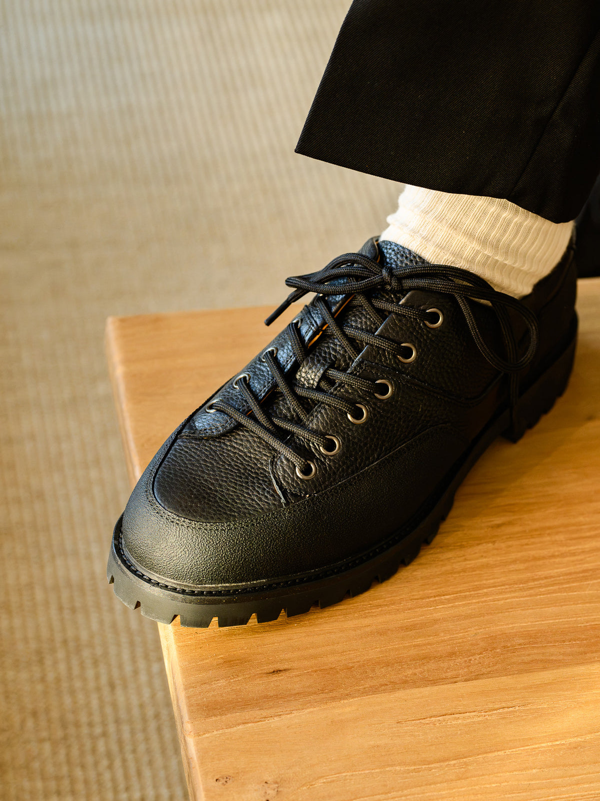 Paper Straight Ridgeworks Low Black — close-up of grain leather, eyelets and welt