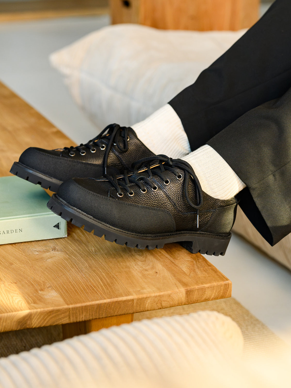 Paper Straight Ridgeworks Low Black — pair worn, in warm light