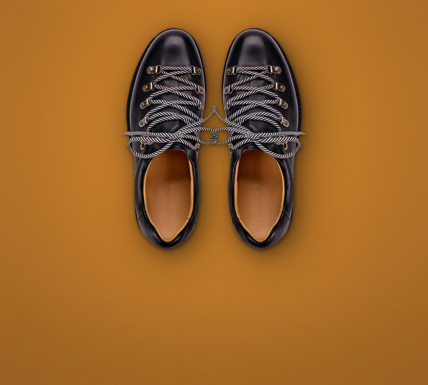 Paper Straight Summit Derby Signature black - pair seen from above on burnt ochre